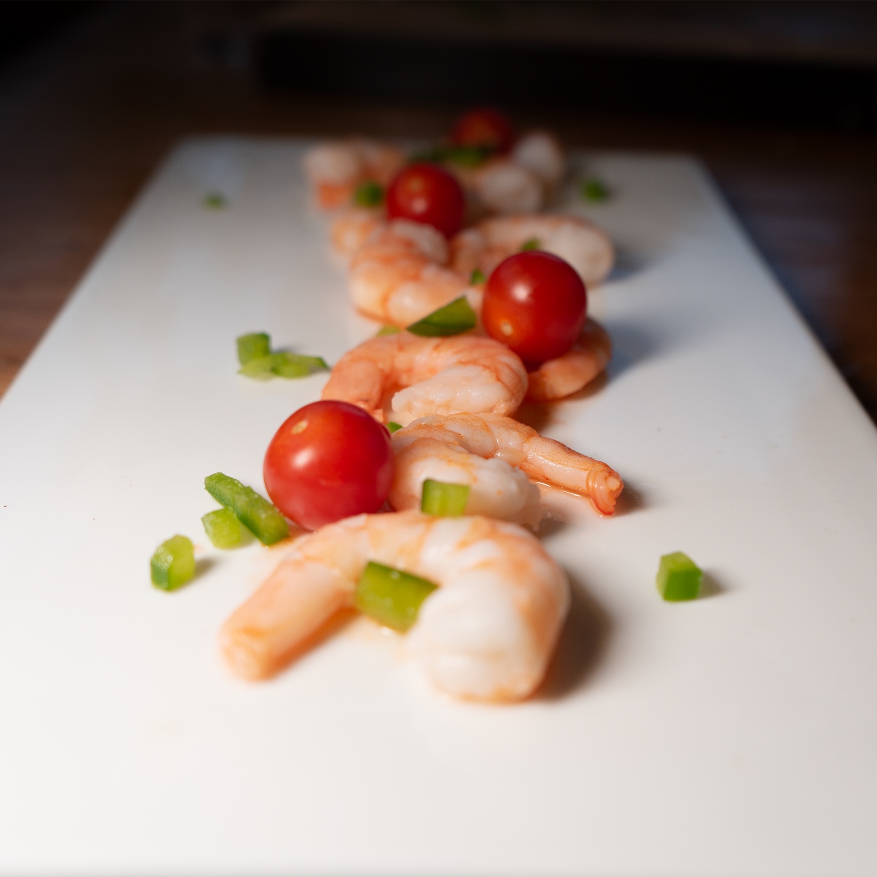 The Healthy Kitchen’s prawns and tomatoes arranged on a white plate